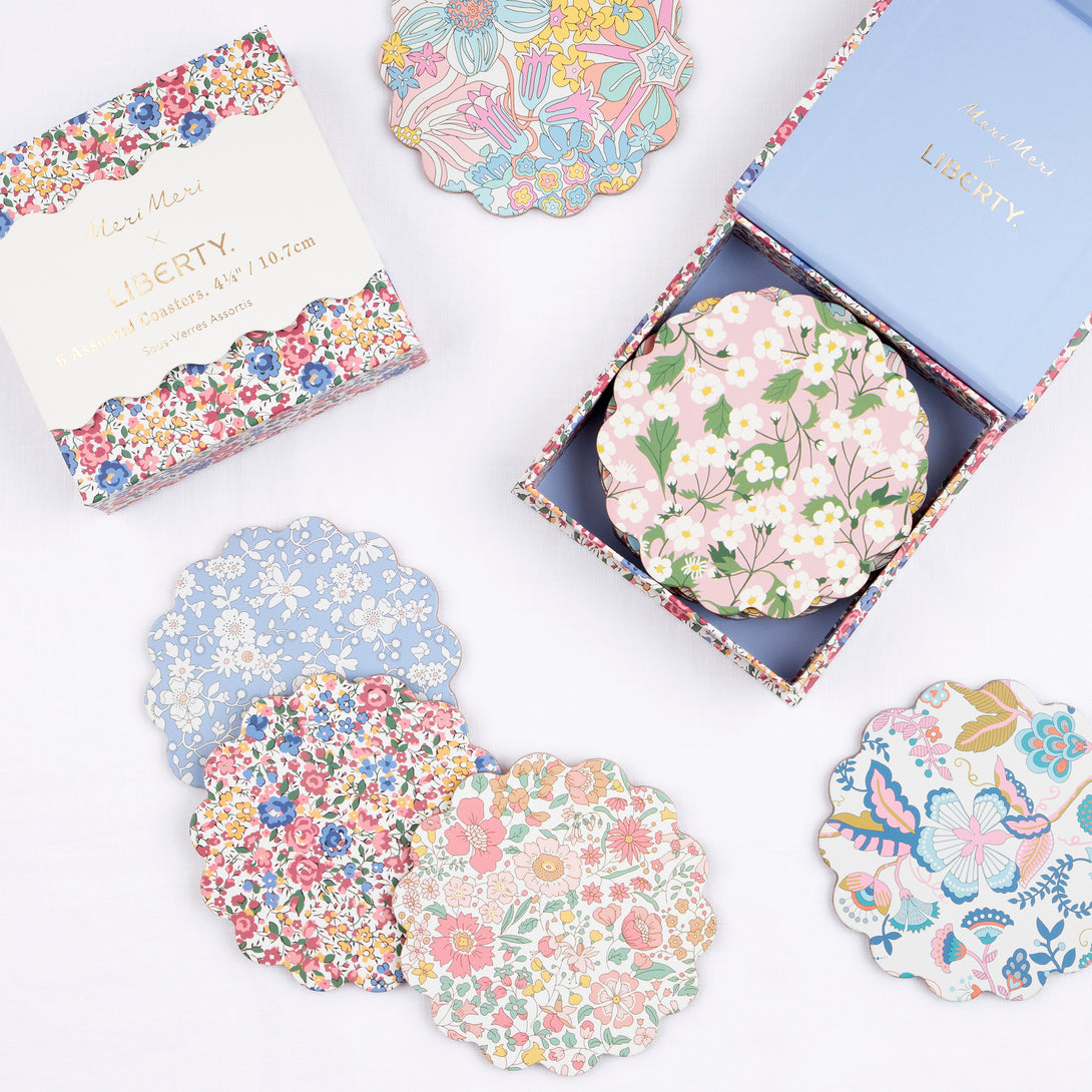 Our wooden coasters are made from a composite wood with floral Liberty prints, a laminated finish and a cork backing. Image1