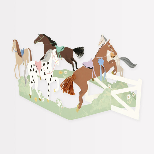 Our horse birthday card features horses, ribbons, tassels and a jump, and makes a great decoration for a horse party.