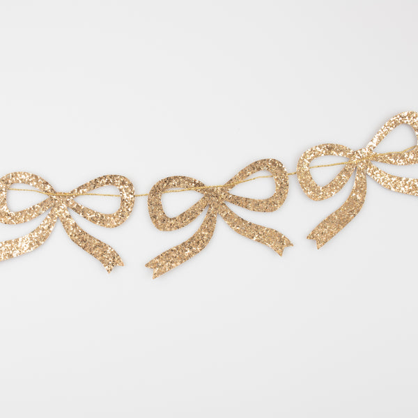 Our Christmas garland is crafted with gold glitter fabric bows, perfect for a Christmas wall decoration or Christmas table decoration. Image3