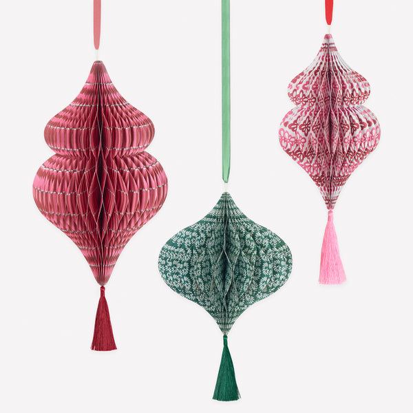 Our hanging Christmas decorations, made from honeycomb, feature stylish Molly Mahon prints designs and shimmering tinsel tassels. Image1