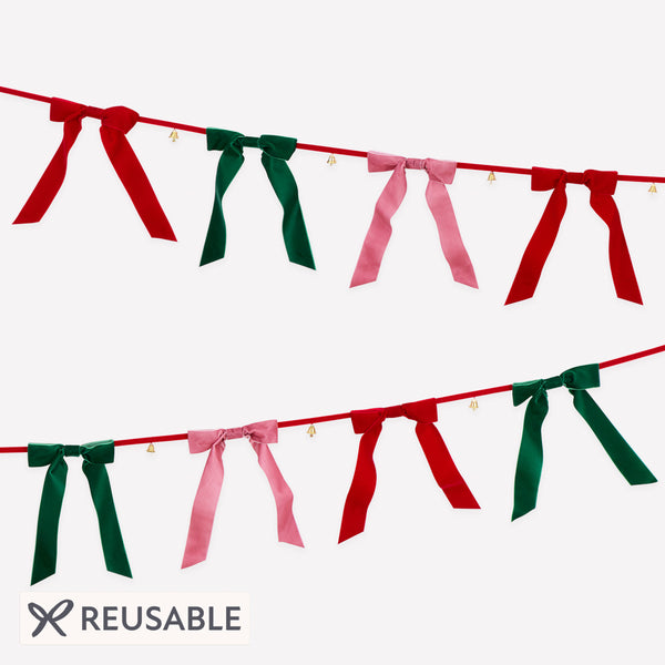 Our Christmas garland features luxurious velvet bows and tinkling bells, hung on a velvet ribbon for an elegant reusable decoration. Image1