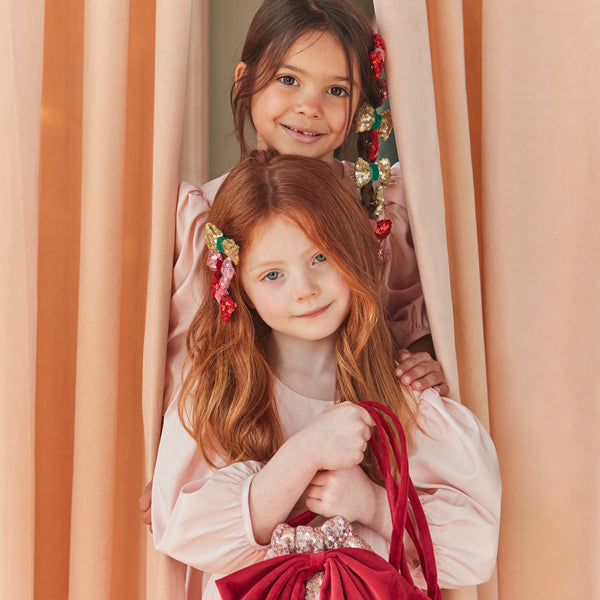 Accessorise your Christmas hairstyle with our sequin bows with velvet details, simply clip on for instant style. Image2