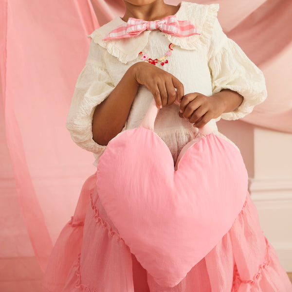 Our Valentine's bag is made in the shape of a puffy heart, a really fun and chic accessory. Also perfect as a chic Valentine's Day gift. Image2