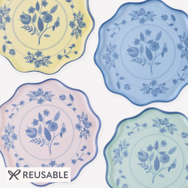 Our large reusable plates, made from practical melamine, come in four pastel shades with a cobalt blue botanical print transfer. Image1