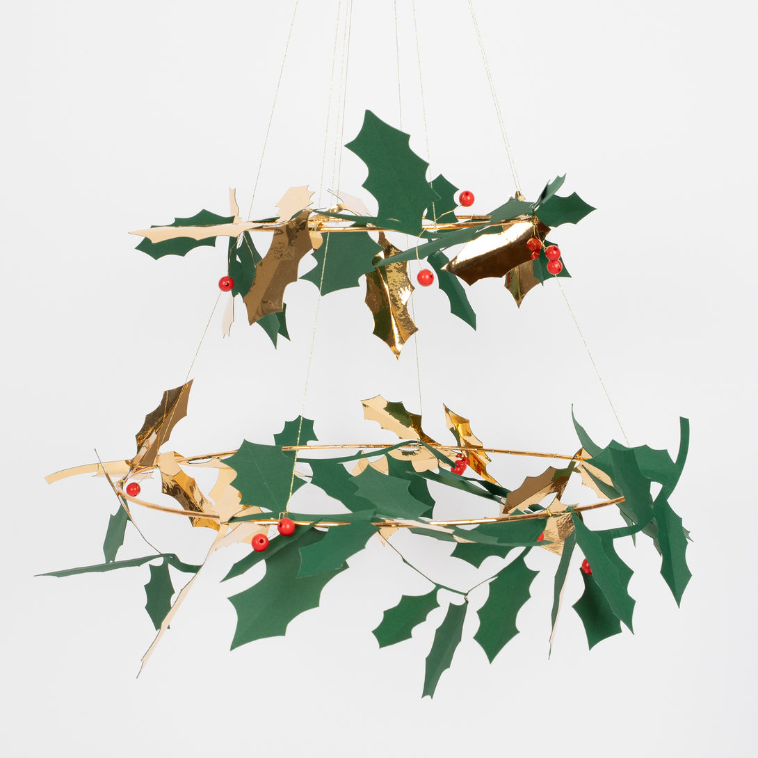 Our holly chandelier, made with metal, wood and paper, makes a beautiful hanging Christmas decoration.