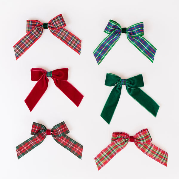 Our Christmas hair clips set features velvet and tartan ribbon bows in festive colours, perfect to pop into party bags or gift. Image2
