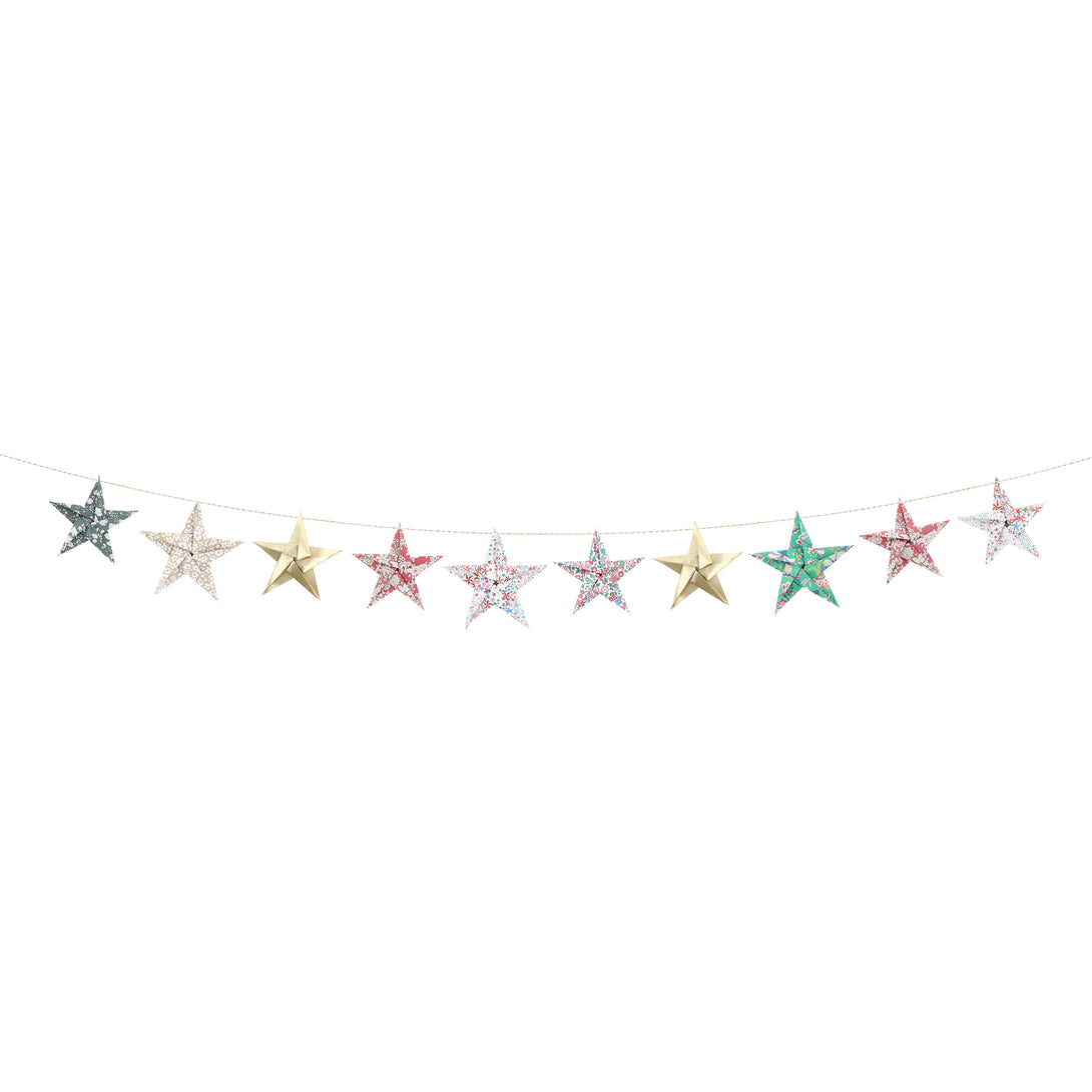 Let our star garland, designed with joyful Liberty star and floral prints and gold foil details, add an elegant touch to your Christmas décor. Image6