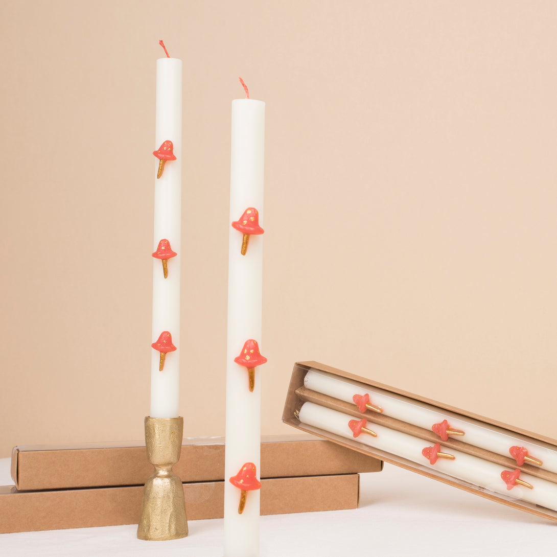 Our Christmas candles, with red and gold mushroom details, have fun red wicks and are perfect as Christmas table decorations.