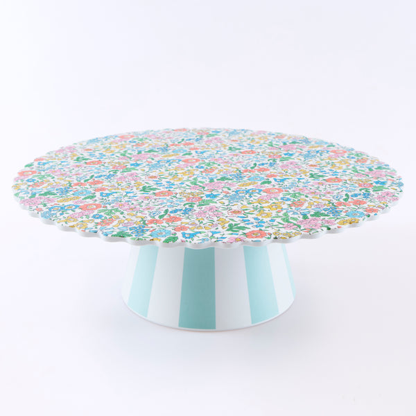 Our melamine cake stand features a pretty Liberty floral print design, with a striped base, a wonderful host gift and perfect for any special party. Image1
