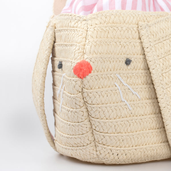 Our Easter bunny basket has a cute face, floppy ears and a pompom tail. Image5