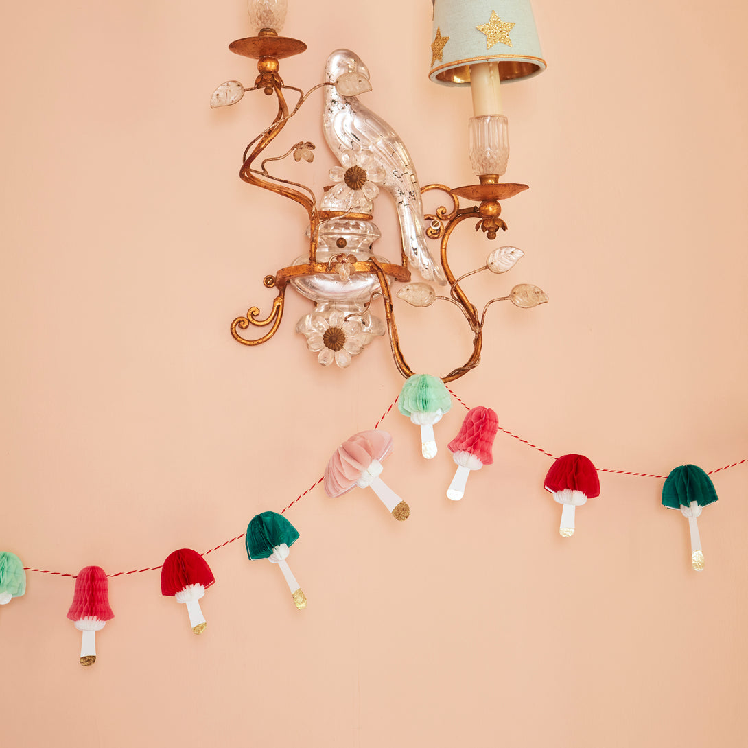 If you're looking for a Christmas wall decoration that's on trend then you'll love our mini paper garland with colourful mushrooms.