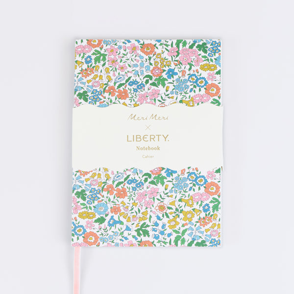 Keep notes or a journal in our beautiful notebook with a floral Liberty print design and a pink velvet ribbon bookmark, a stylish gift for a writer. Image1