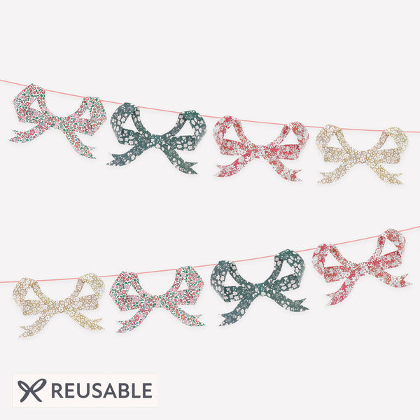 Our Christmas paper garland features 8 bows with joyful Liberty floral patterns and a soft velvet ribbon, for an elegant effect. Image1