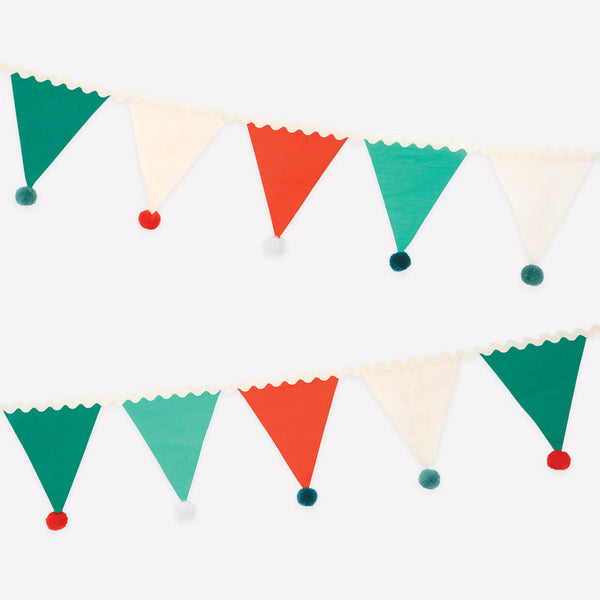 Add our fabric garland, with fun pompom details, to your Christmas party supplies as it makes an amazing and reusable decoration. Image1