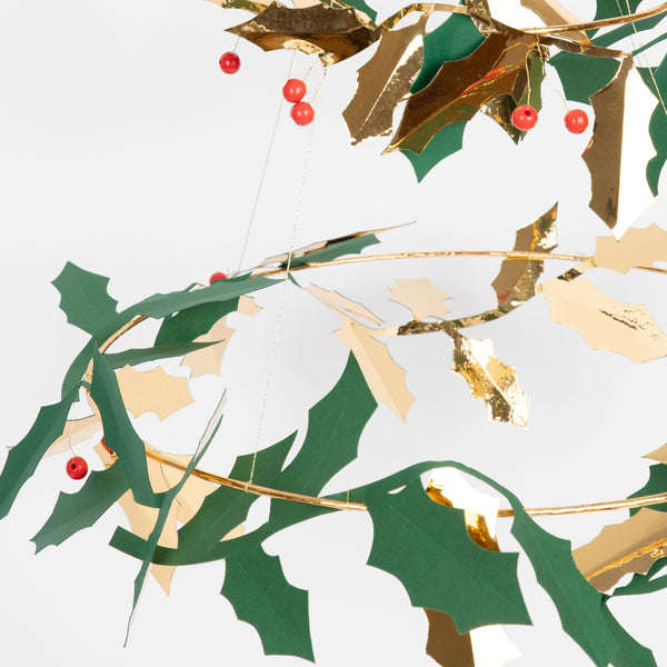 Our holly chandelier, made with metal, wood and paper, makes a beautiful hanging Christmas decoration. Image2