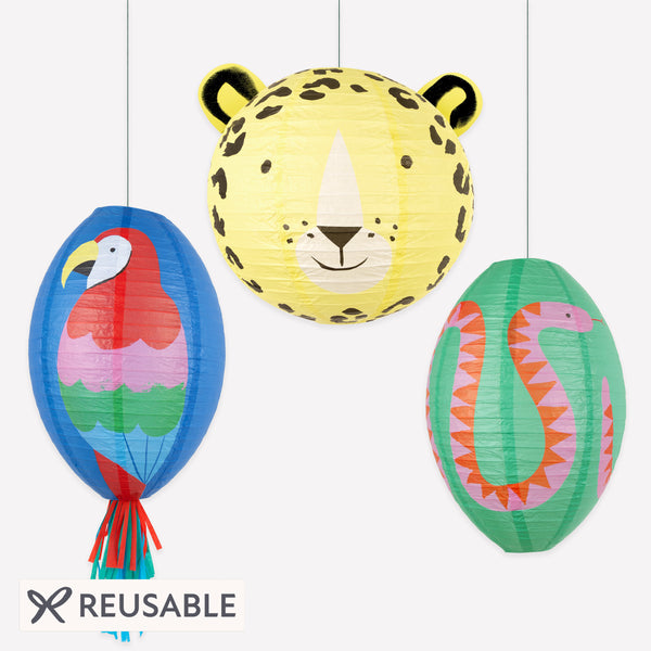 Our jungle party decorations include a set of three paper lanterns with a parrot, jaguar and snake design, perfect for a vibrant touch. Image1