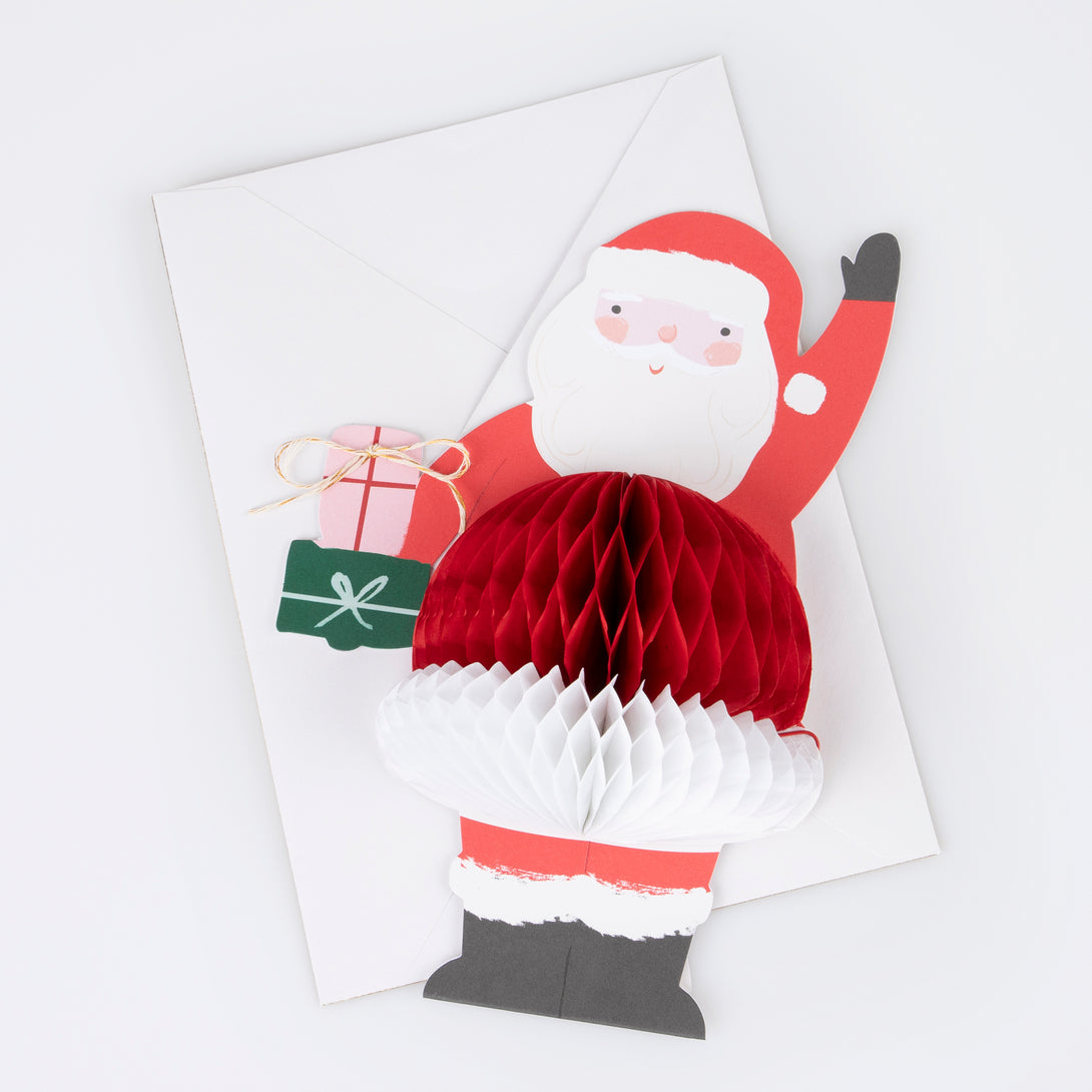 Our Santa card, with honeycomb and metallic twine details, will look amazing as part of your Christmas card display.