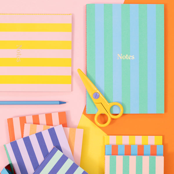 Our lined notebooks come in a set of 3, beautifully designed with vibrant striped covers and a neon coral stitched spine. Image2