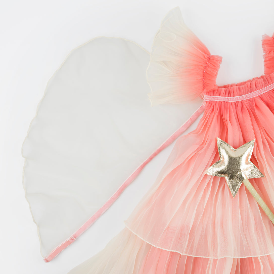Our fairy costume includes a pink fairy dress and wings and a star wand. Image3