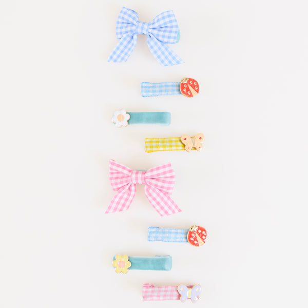 Our hair clip set features 8 designs, with enamel butterflies, flowers and ladybugs, and gingham and velvet ribbons, such stylish accessories. Image2