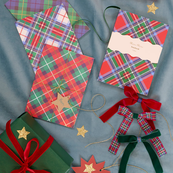 Our notebook set features 3 softcover notebooks with tartan designs in Christmas colours, perfect for someone who loves to write. Image2