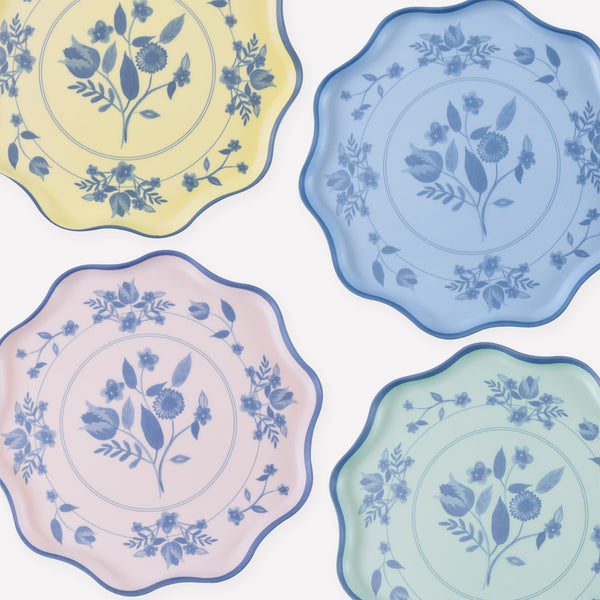 Our large reusable plates, made from practical melamine, come in four pastel shades with a cobalt blue botanical print transfer. Image1