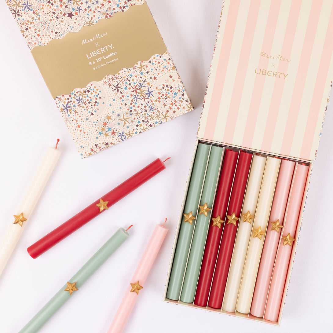 Our Christmas candle gift set features ridged candles with gold star embellishments, presented in a sparkly Liberty star print keepsake box Image1