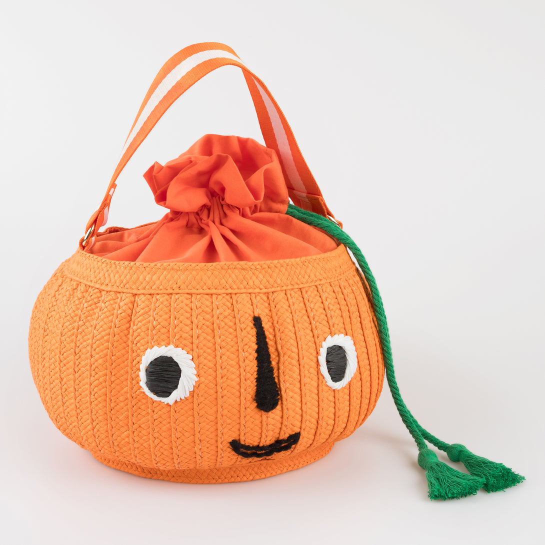 Our Halloween basket has a cute pumpkin face and fun tassels. Image1