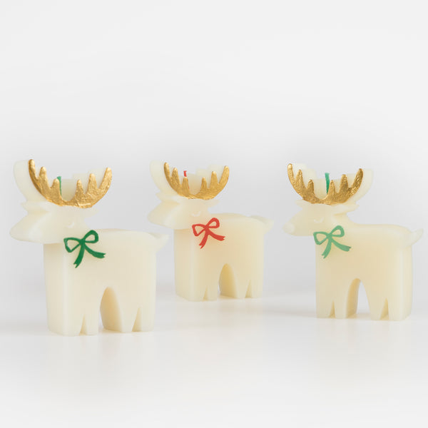 These Christmas table candles are reindeers with on-trend bows, gold details and fabulous coloured wicks, a great host gift. Image2