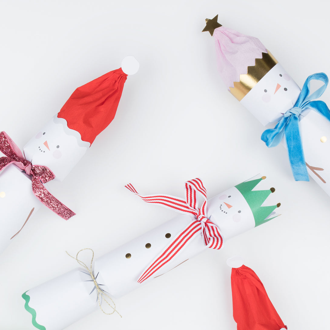 Our fun Christmas crackers have fun snowmen details with hat and scarf embelllishments, and contain fabulous erasers, party hats and jokes.