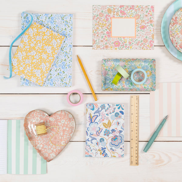 Our jewellery tray is made from enamelled metal, in a heart shape, with a pretty pink and white Liberty floral print design. Image2