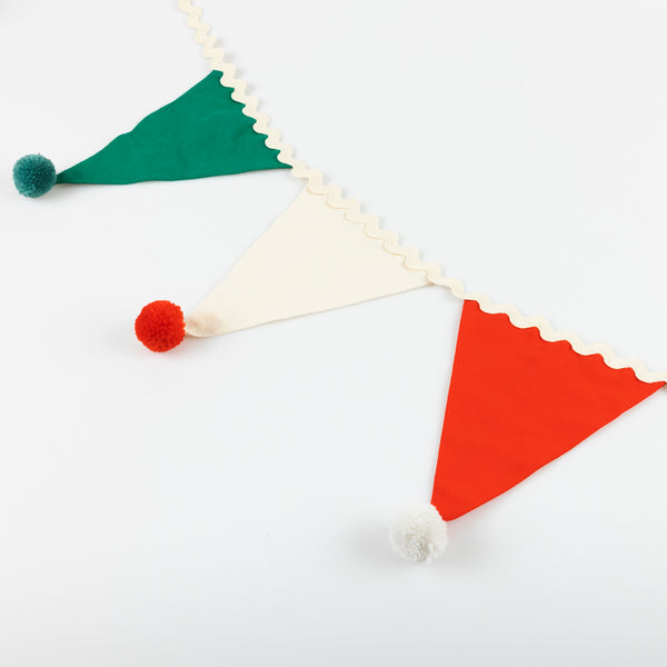 Add our fabric garland, with fun pompom details, to your Christmas party supplies as it makes an amazing and reusable decoration. Image3