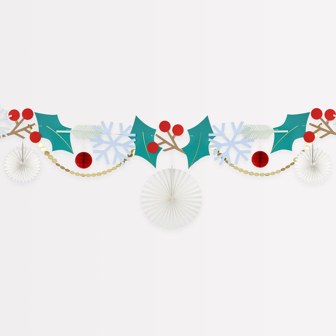 Our Christmas garland includes Christmas foliage with paper holly, berries, snowflakes and honeycomb decorations.