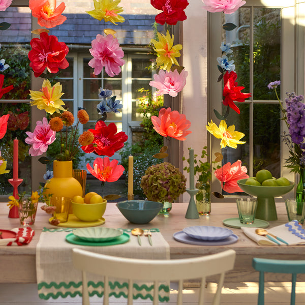 Use our bright flower wall, made with bright tissue paper flowers, to add colour and charm to any party or as a floral home decoration. Image2