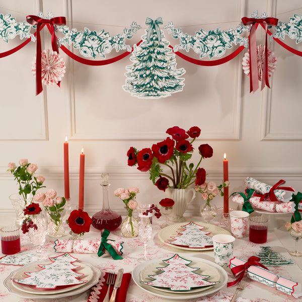 Our Christmas garland has paper foliage, pinwheels and a decorative tree, all with an elegant Toile de Jouy print, topped with ribbon bows. Image2