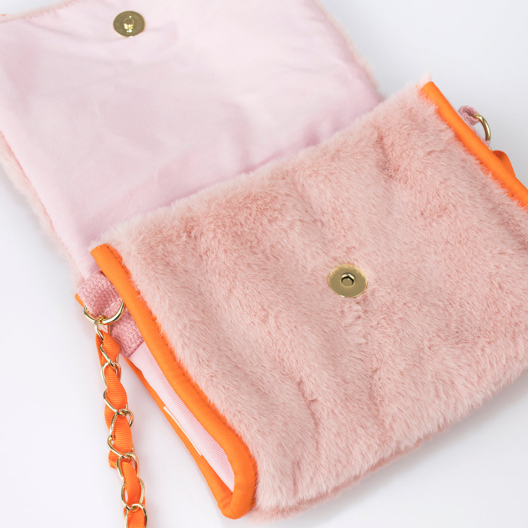Our kids pink bag is crafted from soft plush in the shape of an adorable bunny with floppy ears.