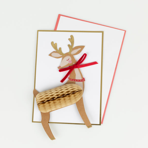 Our reindeer Christmas card stands up to give a wonderful decoration, and features honeycomb paper, a luxe velvet bow and shiny gold foil. Image2