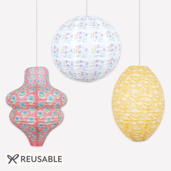 Our paper lanterns, a set of three with pink and yellow floral print designs, feature a round, oval and wavy shape, great for chic parties. Image1
