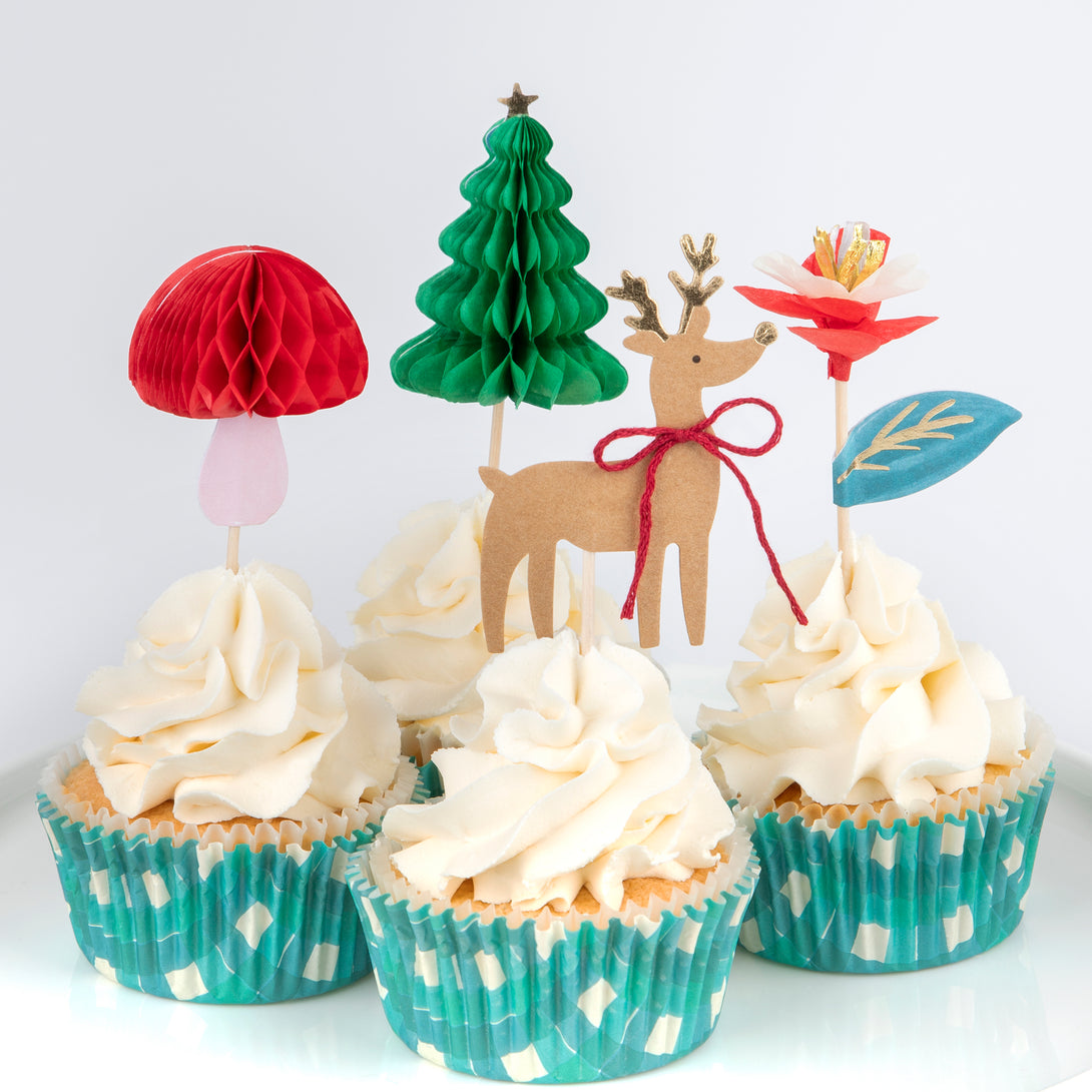 Our special Christmas cupcake kit contains woodland animals, flowers and Christmas tree toppers with striped cupcake cases.