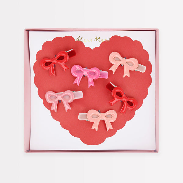 Our luxury red and pink hair clips feature enamel bows and velvet ribbons - the perfect Valentine's hair accessories for kids. Image1