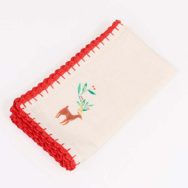 Our Christmas fabric napkins are made from an ivory linen and cotton blend, with festive motifs, embroidered details and crochet borders. Image7