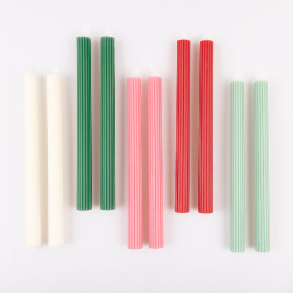 Our Christmas candle gift box features 10 ridged table candles, in 5 joyful colours, presented in a box with a classic Liberty print designs. Image4