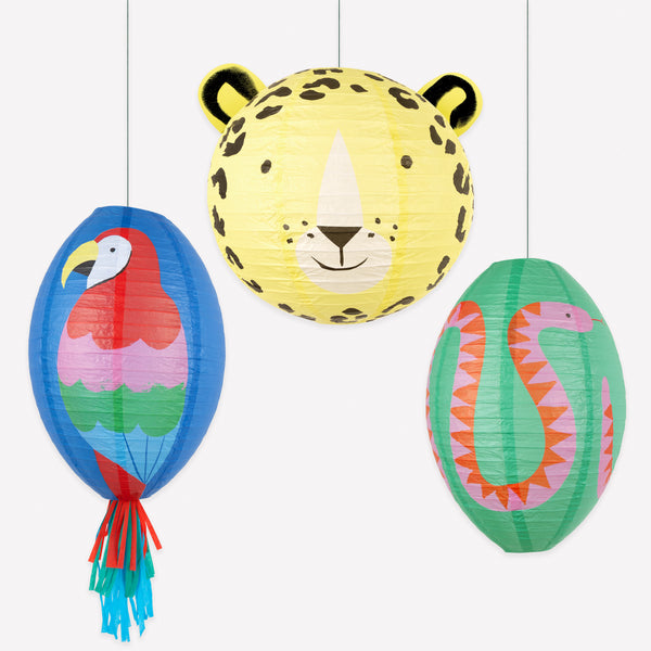 Our jungle party decorations include a set of three paper lanterns with a parrot, jaguar and snake design, perfect for a vibrant touch. Image1