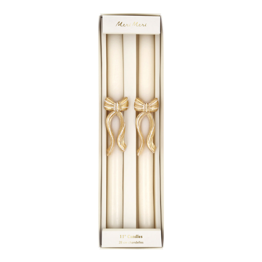 Our Christmas table candles have a stylish gold and white striped bow design to add sophistication to your dinner table or mantel. Image5