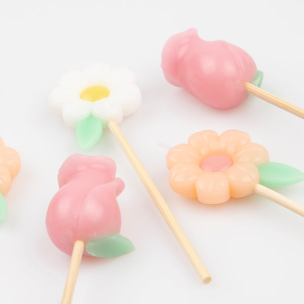 Use our pastel floral candles as birthday cake decorations for a pretty look. Image4
