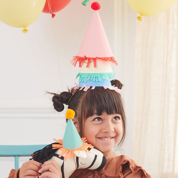 Our paper hats feature fringing, pompoms and bright colours. Image2