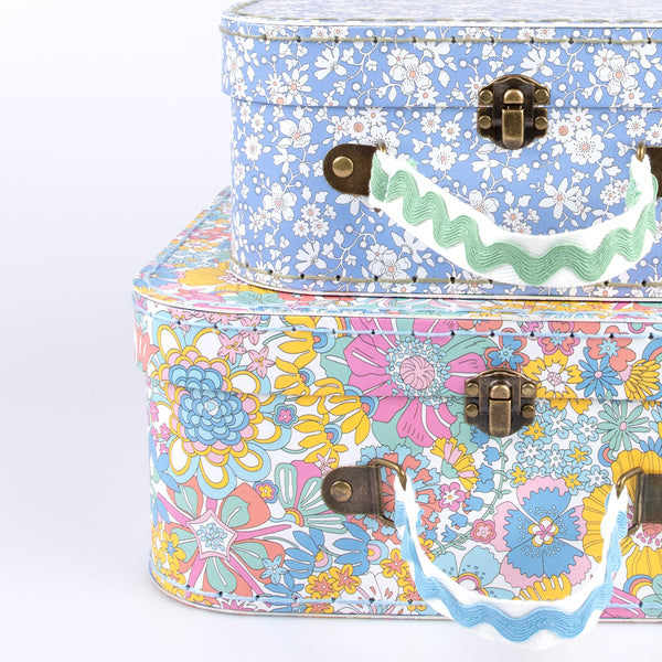 Our mini suitcases feature Liberty floral print designs and stitched card, so are sophisticated travel accessories and storage solutions. Image4