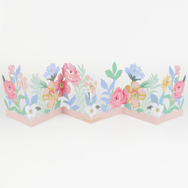 Our congratulations card features pretty paper flowers with shiny gold foil details, and an insert with a 'Congratulations' message. Image1