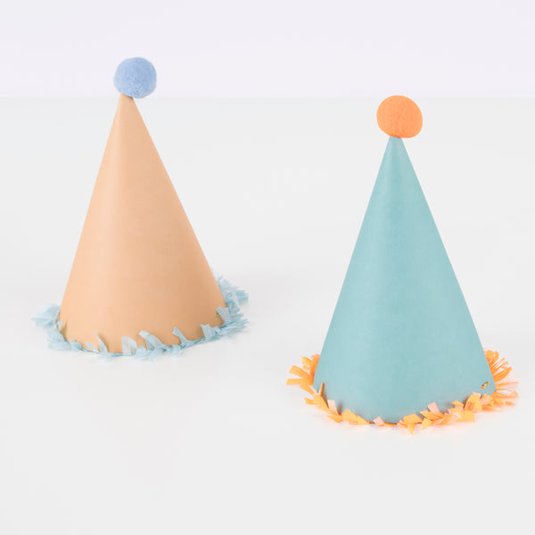 Our paper hats feature fringing, pompoms and bright colours. Image5