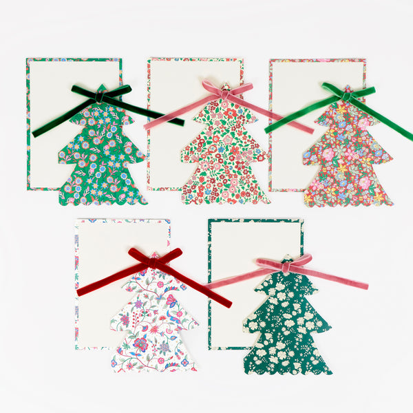 Our Christmas card set features 10 tree shaped cards with 5 different Liberty print designs, topped with velvet ribbon bows for a stylish look. Image1